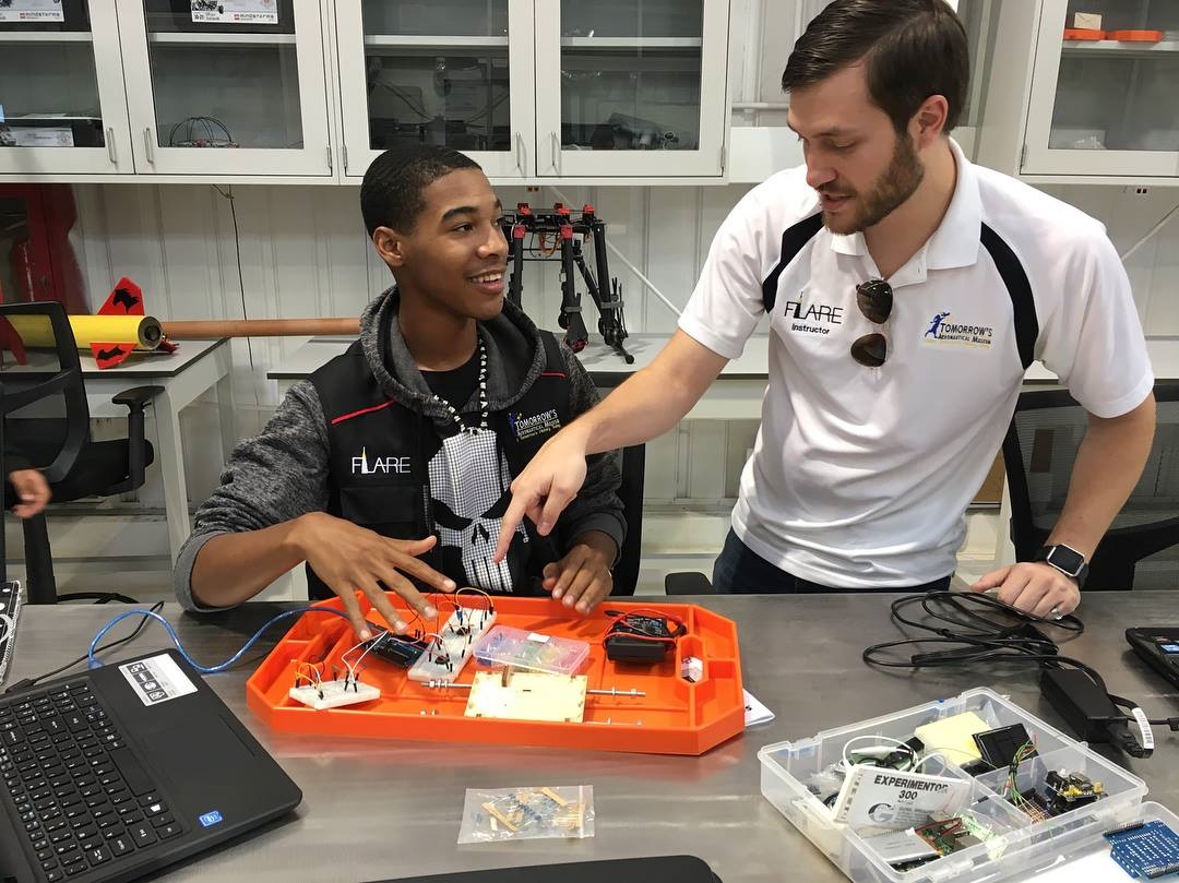 Keith and a student working on an Arduino project